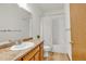Well-lit bathroom with granite countertops, an oval sink, and a shower-tub combination, accented with wood look flooring at 1100 Columbine Way, Erie, CO 80516