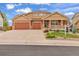 Inviting two-story home boasts a large front yard, covered porch and a three car garage, perfect for Gathering living at 1100 Columbine Way, Erie, CO 80516