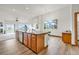 Open concept kitchen featuring center island, eat-in dining, and breakfast bar with scenic view at 1100 Columbine Way, Erie, CO 80516