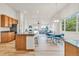 Open concept kitchen with granite countertops, stainless steel appliances, and an eat-in dining area at 1100 Columbine Way, Erie, CO 80516