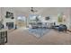 Bright living room with vaulted ceilings, gas fireplace, and a sliding glass door to deck and stunning views at 1100 Columbine Way, Erie, CO 80516