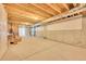 Unfinished basement with exposed ceiling beams and concrete flooring at 6335 E 143Rd Dr, Thornton, CO 80602