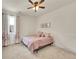 Bedroom featuring neutral walls, carpet, one window and ceiling fan at 6335 E 143Rd Dr, Thornton, CO 80602