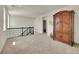 Bonus Room with black metal stair railing and large, wooden cabinet at 6335 E 143Rd Dr, Thornton, CO 80602