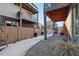 Private backyard patio with covered seating area and snow at 4129 Coriander St, Castle Rock, CO 80109