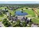 Picturesque aerial view of the golf course community, clubhouse, and water feature at 9151 E Harvard Ave, Denver, CO 80231