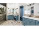 Bright bathroom with spacious vanity area, well-lit mirror, and beautifully tiled shower at 9151 E Harvard Ave, Denver, CO 80231