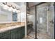 Beautiful bathroom boasting a tiled walk-in shower and vanity with ample storage at 9151 E Harvard Ave, Denver, CO 80231