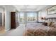 A bedroom with backyard access has carpet floors and big windows for plenty of light at 9151 E Harvard Ave, Denver, CO 80231
