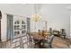 Formal dining room with a beautiful chandelier and large windows at 9151 E Harvard Ave, Denver, CO 80231