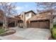 Lovely stone home with a terracotta roof and a three car garage at 9151 E Harvard Ave, Denver, CO 80231