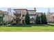 Beautiful exterior elevation with covered balconies and lush green landscaping at 9151 E Harvard Ave, Denver, CO 80231