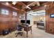 Executive home office with rich wood trim and an expansive view through the glass wall at 9151 E Harvard Ave, Denver, CO 80231