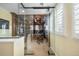 Executive home office with glass walls providing an open and modern workspace at 9151 E Harvard Ave, Denver, CO 80231