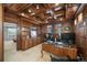 Executive home office featuring rich wood trim, built in bookshelves and a view to the bedroom at 9151 E Harvard Ave, Denver, CO 80231