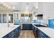 Stylish kitchen offers stainless appliances, a gas range, and blue backsplash at 9151 E Harvard Ave, Denver, CO 80231