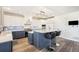 Beautiful kitchen with two-toned cabinets, center island, and stainless steel appliances at 9151 E Harvard Ave, Denver, CO 80231