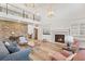 Spacious living room with a stone fireplace and plenty of natural light at 9151 E Harvard Ave, Denver, CO 80231