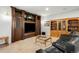 Spacious living room with custom built-ins and ample seating, perfect for entertaining guests at 9151 E Harvard Ave, Denver, CO 80231