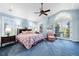 Spacious main bedroom with backyard views, ceiling fan and private ensuite bathroom at 9151 E Harvard Ave, Denver, CO 80231