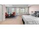 Serene main bedroom with bright windows, sitting area, and access to outdoor space at 9151 E Harvard Ave, Denver, CO 80231