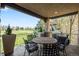 Relaxing covered patio boasts outdoor seating and views of the golf course at 9151 E Harvard Ave, Denver, CO 80231