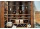 Climate-controlled wine cellar with custom wood racks, ample storage, and display lighting at 9151 E Harvard Ave, Denver, CO 80231