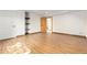 Basement bedroom with wood-trimmed flooring, shelving, and an open closet at 1199 Links Ct, Erie, CO 80516