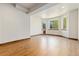 Bright basement featuring a bay window and wood-trimmed flooring at 1199 Links Ct, Erie, CO 80516