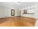 Unfurnished basement featuring a bar and wood-trimmed flooring throughout at 1199 Links Ct, Erie, CO 80516
