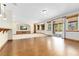 Spacious basement with a large TV, built-in shelving, and walk-out access to the patio at 1199 Links Ct, Erie, CO 80516