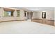 Basement featuring a sliding glass door, carpet, and wood-trimmed flooring at 1199 Links Ct, Erie, CO 80516