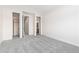 Empty room with closet and doorways to other rooms at 1199 Links Ct, Erie, CO 80516