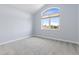 Cozy room with vaulted ceiling and a large window for natural light at 1199 Links Ct, Erie, CO 80516