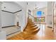 Grand foyer with curved staircase, tile flooring, and soaring ceilings at 1199 Links Ct, Erie, CO 80516
