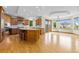 Spacious kitchen with wood cabinets, stainless steel appliances and large island with bar seating at 1199 Links Ct, Erie, CO 80516