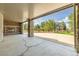 A covered patio area showcases stone supports and a fireplace, creating a comfortable backyard atmosphere at 1199 Links Ct, Erie, CO 80516