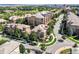 Stunning aerial view of a neighborhood showcasing lush landscaping, well-maintained streets, and diverse architectural styles at 7887 Vallagio Ln, Englewood, CO 80112