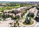 Community aerial shot with a roundabout and well-manicured landscaping at 7887 Vallagio Ln, Englewood, CO 80112