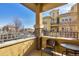Relaxing balcony with neutral tones and room for a small table and seating with a view at 7887 Vallagio Ln, Englewood, CO 80112