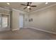 Neutral bedroom with plush carpeting, ample natural light, and crown molding details at 7887 Vallagio Ln, Englewood, CO 80112