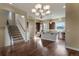 A view of an open concept kitchen with a staircase and stainless steel appliances at 7887 Vallagio Ln, Englewood, CO 80112