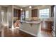 A view of a kitchen with a center island and wooden cabinets at 7887 Vallagio Ln, Englewood, CO 80112