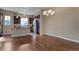 An open-concept kitchen with a stainless steel refrigerator at 7887 Vallagio Ln, Englewood, CO 80112
