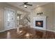 A cozy living room with a fireplace and hardwood floors at 7887 Vallagio Ln, Englewood, CO 80112