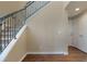 This is a staircase with black metal railings and wood floor at 7887 Vallagio Ln, Englewood, CO 80112