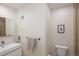 Neutral bathroom featuring a modern floating vanity with a sleek faucet, toilet, and shower at 62 Jasmine St, Denver, CO 80220
