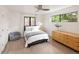 Minimalist bedroom with modern furnishings, including a comfortable bed, dresser, and cozy beanbag chair at 62 Jasmine St, Denver, CO 80220