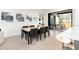 Modern dining area with hardwood floors, contemporary art, and a view of the patio at 62 Jasmine St, Denver, CO 80220