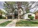 Stunning home with mature trees, a manicured lawn, and a modern design exuding elegance at 62 Jasmine St, Denver, CO 80220